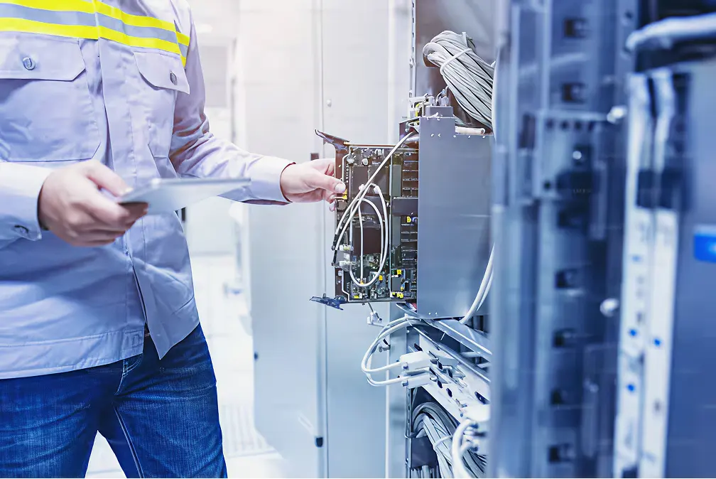 Technician inspecting server hardware in a secure lab